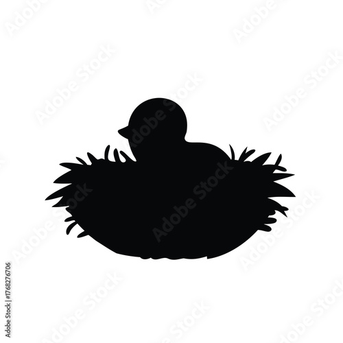 Silhouette of a Baby Bird in a Nest Waiting for its Mother