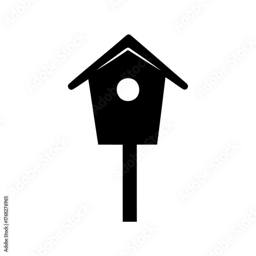 Simple Black Silhouette of a Birdhouse on a Post Against White Backdrop