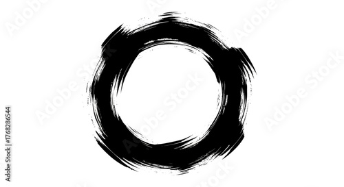 Abstract black ink circle on white backdrop evoking artistic expression and simplicity