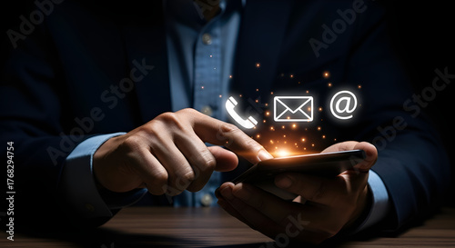 Business professional interacting with digital communication icons on smartphone screenStock photo for website - Business and technology concept photo