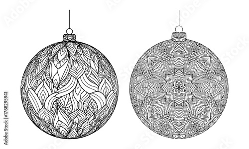Two ornate transparent christmas baubles with intricate patterns isolated studio shot isolated on white background