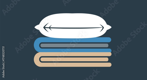 A stack of folded towels and a pillow sits on a dark background.