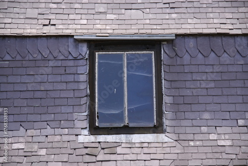 Old Window in Brick Wall
Weathered window framed by aged, cracked, and neglected bricks.

