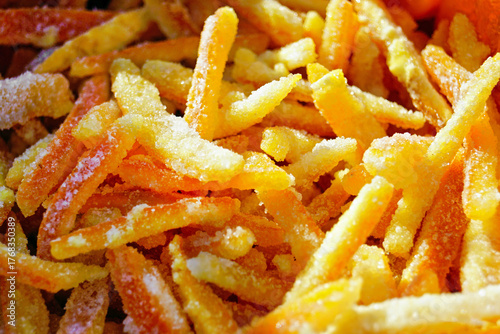 Candied orange peels coated in sugar. Symbol of natural sweetness, zero waste cooking, and eco friendly dessert trends. Represents sustainability in food design and seasonal handmade production.