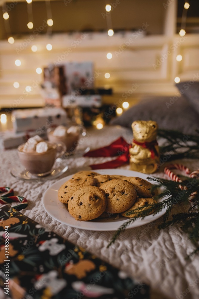 Naklejka premium Christmas Cookies and Hot Chocolate by the Lights