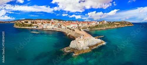 Italy , Tuscany tourism scenic places and coastal towns - charming Piombino in Livorno province. aerial drone panoramic view with lighthouse and old town