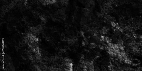 Black stone concrete grunge texture and backdrop  anthracite panorama,  black and white decorative plaster abstract grey color design, light with gradient background, old loft style raw concrete wall.