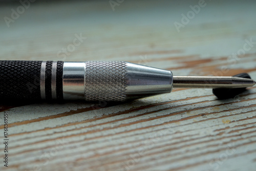 Fragment of auto center puncher hole marker