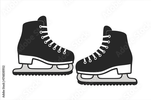Classic black ice skates with white laces and silver blades ready for skating on ice rink