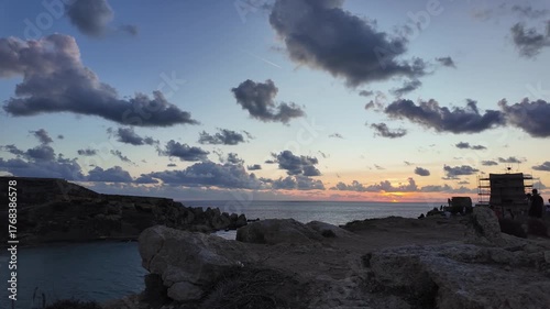 timelap of sunset at Għajn Tuffieħa, Riviera Bay, Malta