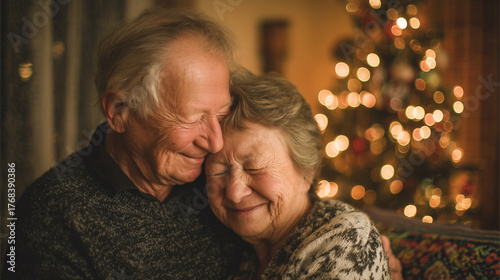 A heartwarming portrait of an elderly couple, embracing with eyes closed, radiating warmth and affection in a cozy indoor setting, with blurred Christmas lights in the background.