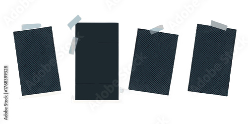 Four blank instant photo prints with textured dark blue surfaces attached with tape on a black background