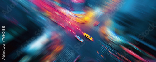 Abstract urban landscape, motion blur, aerial view. Cars speed through city streets, vibrant colors. Perfect for conveying energy, speed,  futuristic ideas.