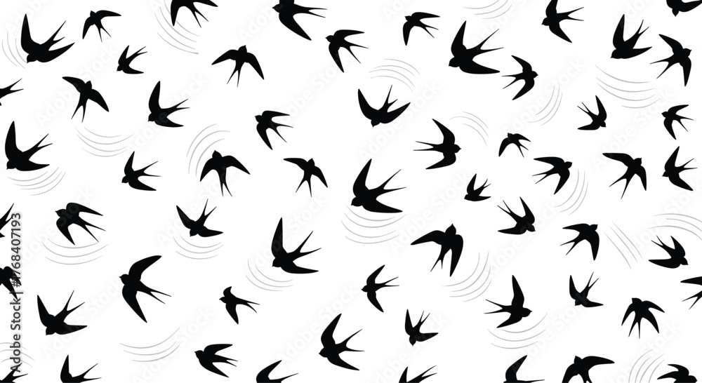 Fototapeta premium A pattern of stylized black swallows in flight against a white background.
