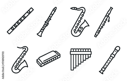 Various musical wind instruments on dark background