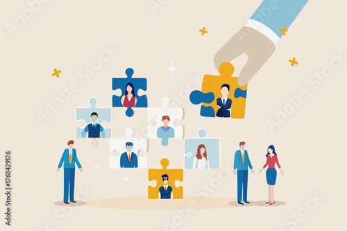 Hand placing a puzzle piece with a businessman into a team of diverse professionals represented by puzzle pieces