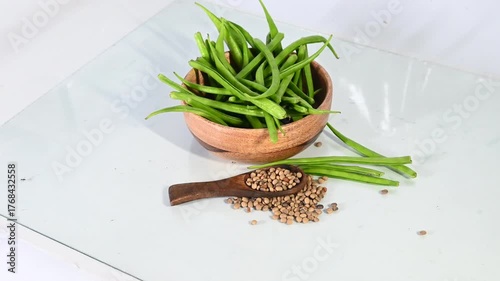 cluster beans or gawar phali(guar) and seed on the white background,cyamopsis tetragonoloba