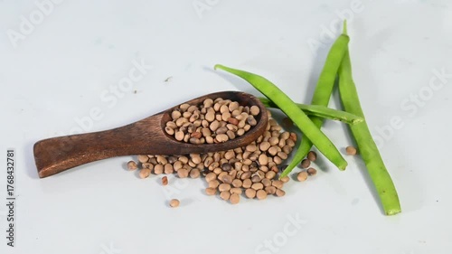 cluster beans or gawar phali(guar) and seed on the white background,cyamopsis tetragonoloba