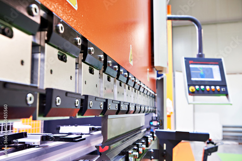 Metal sheet bending industrial machine