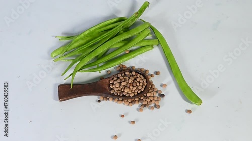 cluster beans or gawar phali(guar) and seed on the white background,cyamopsis tetragonoloba