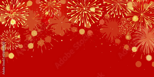 Bright yellow and orange fireworks explode against a vibrant red background with scattered bokeh lights