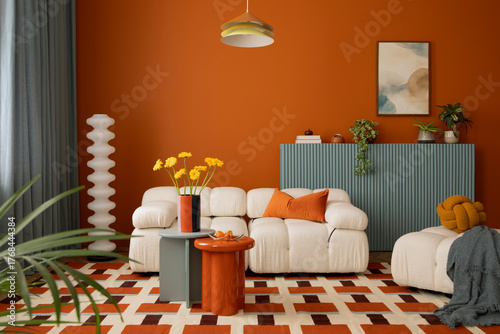 Contemporary colorful interior with modular sofa, warm orange tones, patterned rug, and minimalist furniture.