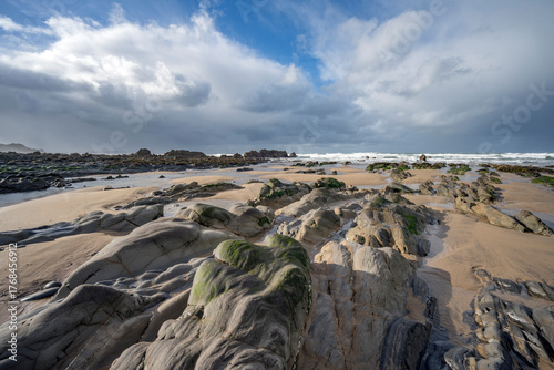 Ancient rock formations on Cornwalls Sandymouth Bay beach