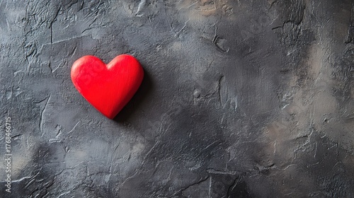 adoration. A red heart symbol stands out against a textured black background with a warm glow. wellbeing guides, coaching materials, designed for coaching and self-improvement content.