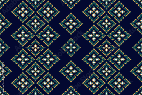 Seamless pattern of applied Thai geometric flowers in gold and green on a dark blue background. Luxurious style for textiles.