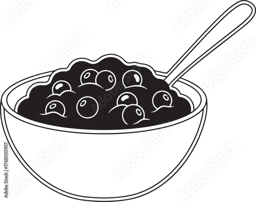 A bowl of blackberries with a spoon in it.