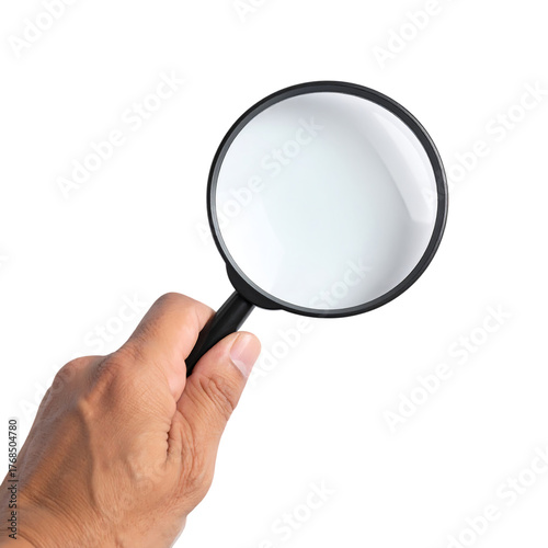 Hand holding a magnifying glass with a clear lens