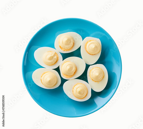 Wallpaper Mural blue plate with boiled chicken egg halves with mayonnaise isolated on a white background, top view. Torontodigital.ca