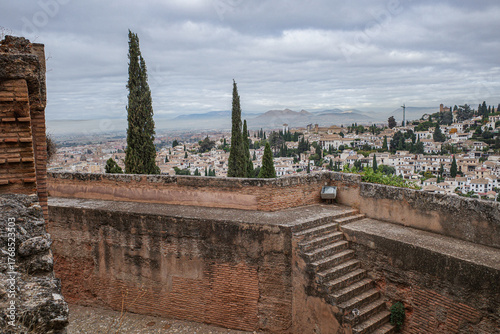 Granada, Spain - 21 Oct 2025: View of Granada cityscape from the Alcazaba, fortress towers and outer walls of Alhambra