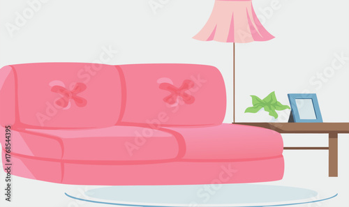 a pink couch and lamp