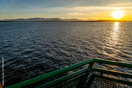 Canvas Print Ferry ship transporting people at golden sunset