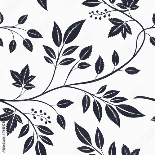 Elegant dark silhouette of swirling branches with detailed leaves and small berries on a white background