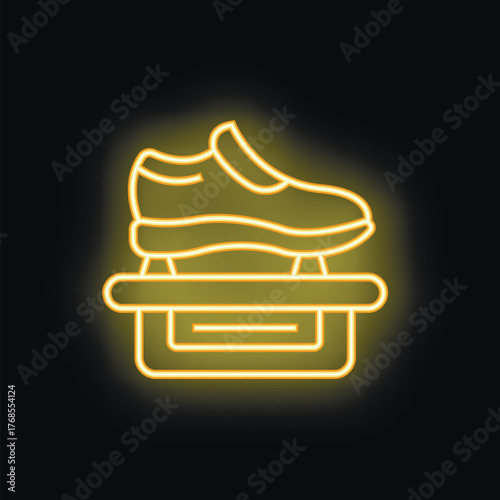 Neon sign representing a shoe on a stand, probably used to promote a shoe store or a shoe brand