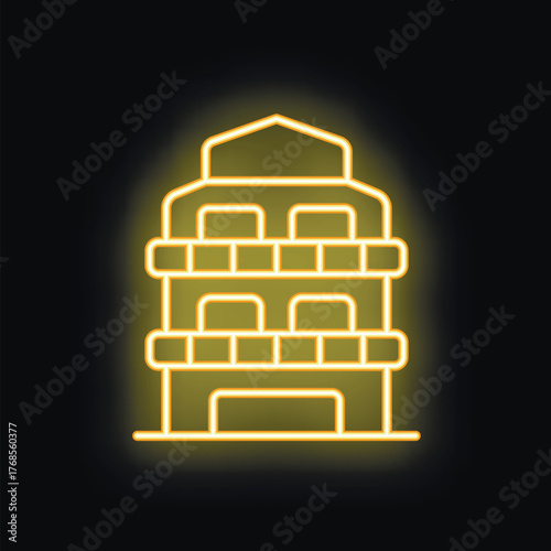 Yellow glowing neon sign representing modern multi storey building with balconies on black brick wall background