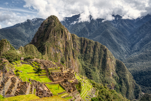 The iconic view with the Inca citadel Machu Picchu in the Andes Mountains of Peru