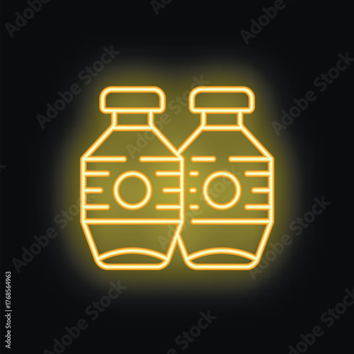 Two neon yellow plastic bottles with sport water on black background with backlight glowing
