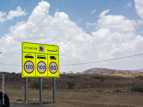Road sign showing different speed limits by vehicle type on Saudi Arabian roads