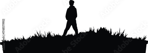 Silhouette of a person standing on grass isolated on transparent background