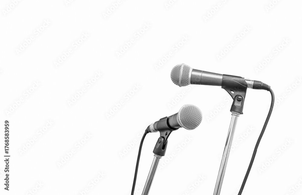 Obraz premium Group of microphones on stands isolated on white background, symbolizing press conference, public speech, or media communication