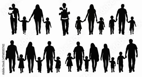 Silhouettes of families walking together with parents holding hands with their children in black and white