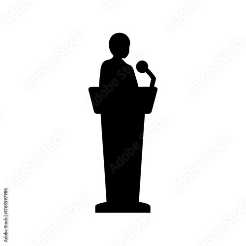 Silhouette of a public speaker giving a speech behind a podium