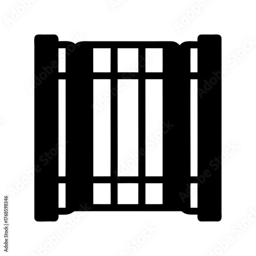 Silhouette image of a closed black wooden gate with six openings