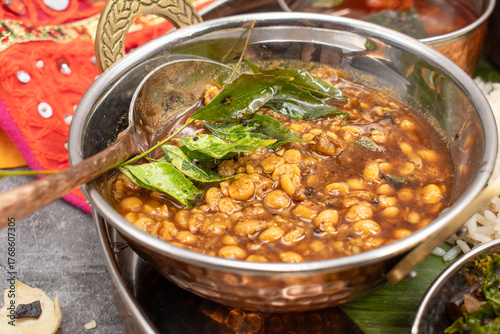 Indian lentils, dal, in a traditional  copper bowl
