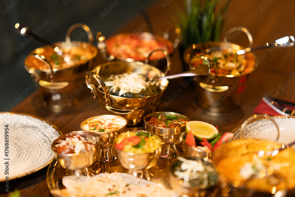 Naklejka premium Indian Thali Set with Curry and Rice in Golden Bowls