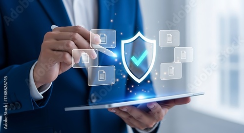 Data security and document management concept with businessman holding a tablet and security shield and document icons floating around symbolizing safe document handling