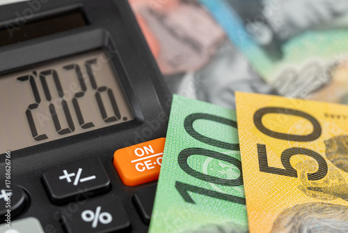 Australia money. Finances 2026. Business and economic concept. Symbol of the Australian dollar. Year 2026 displayed on a calculator. Financial background. Close up